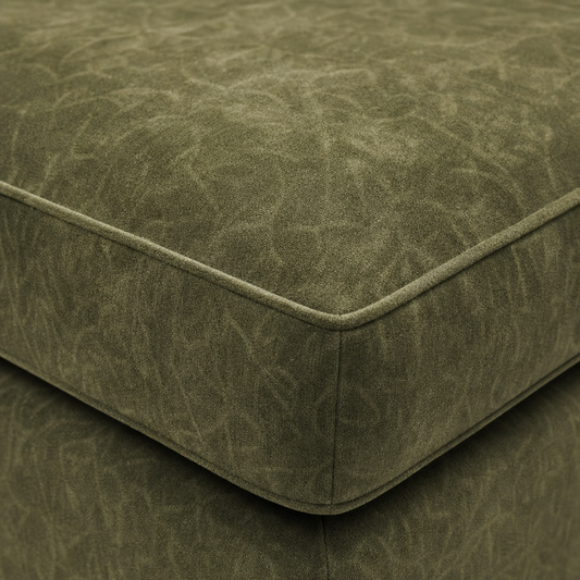 Close-up of a green textured ottoman corner