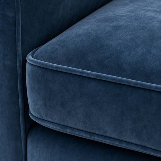 Close-up of a blue velvet sofa cushion