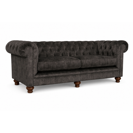 Gray tufted sofa with wooden legs on a white background