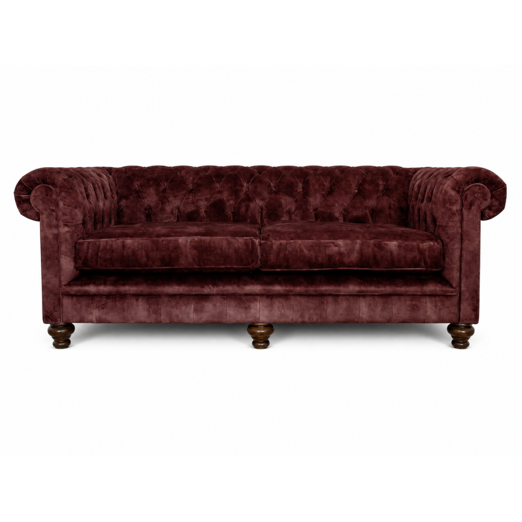 Maroon velvet sofa on a white background