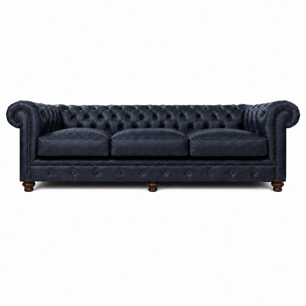 Navy blue tufted sofa on a white background