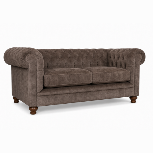 Brown sofa with tufted backrest on a white background