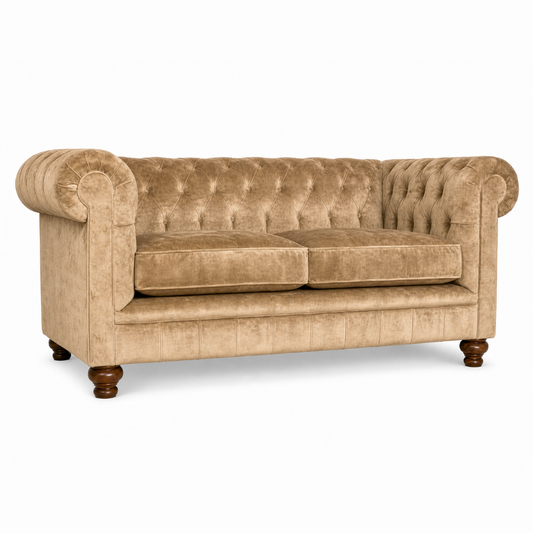 Beige velvet sofa with tufted backrest on a white background