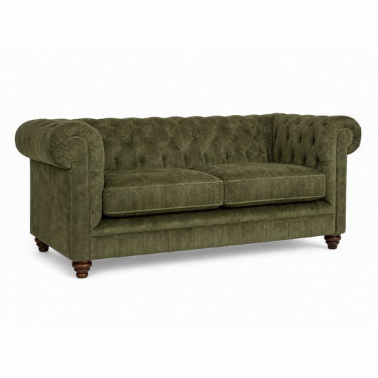 Green sofa with tufted backrest on a white background