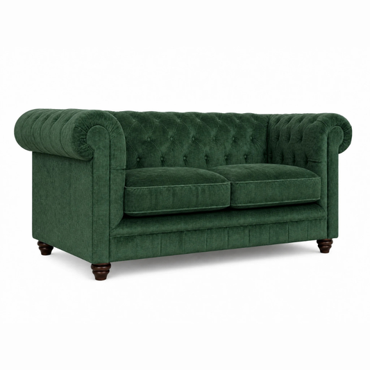 Green velvet sofa on a white background