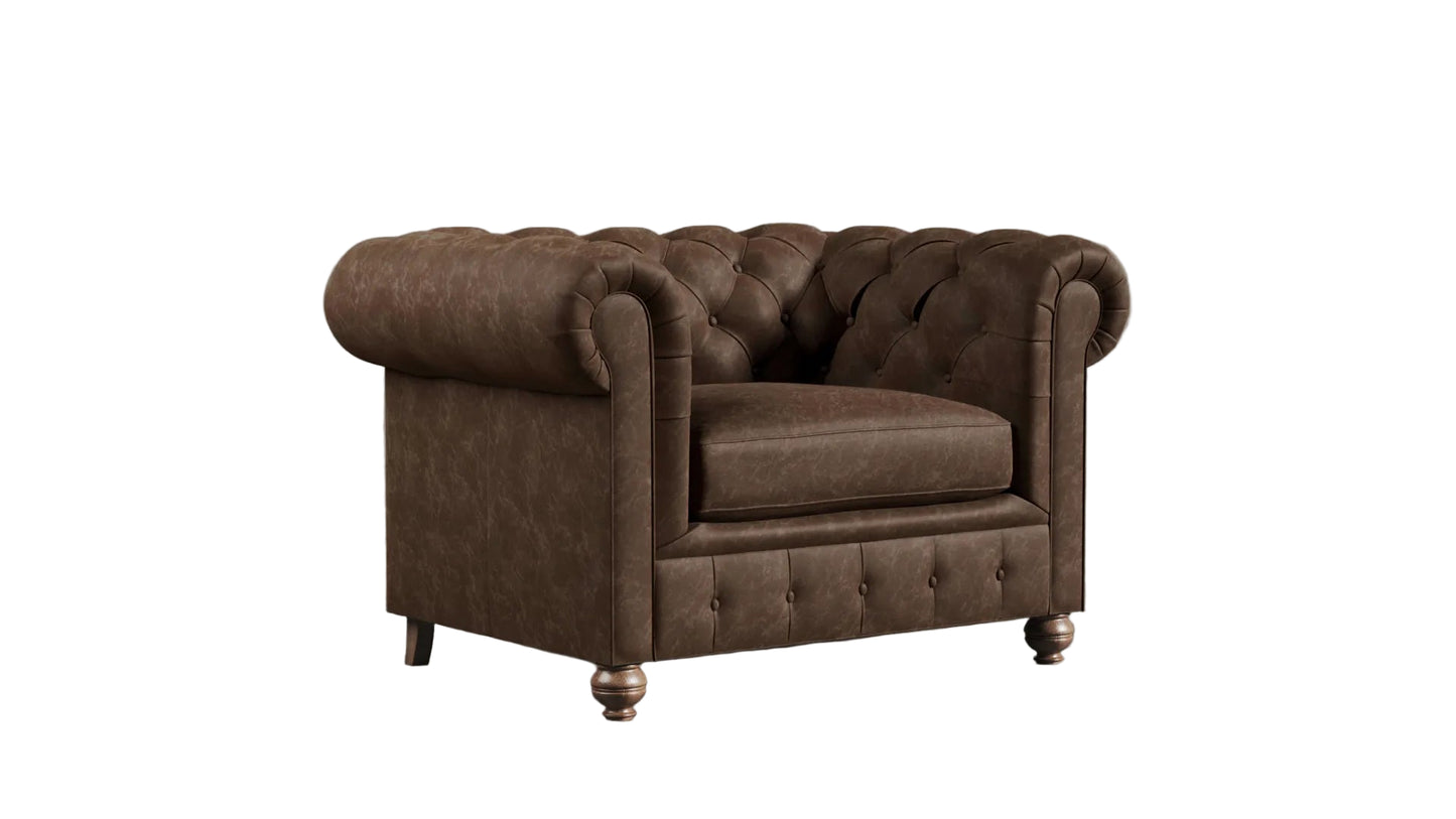 Brown leather chesterfield sofa against a textured wall.
