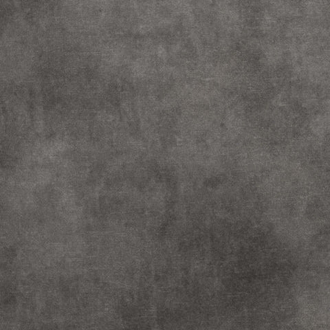 A close-up of a dark gray textured surface with a mottled, stone-like finish.