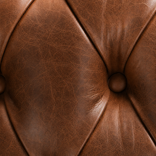 Close-up of brown leather with a button detail