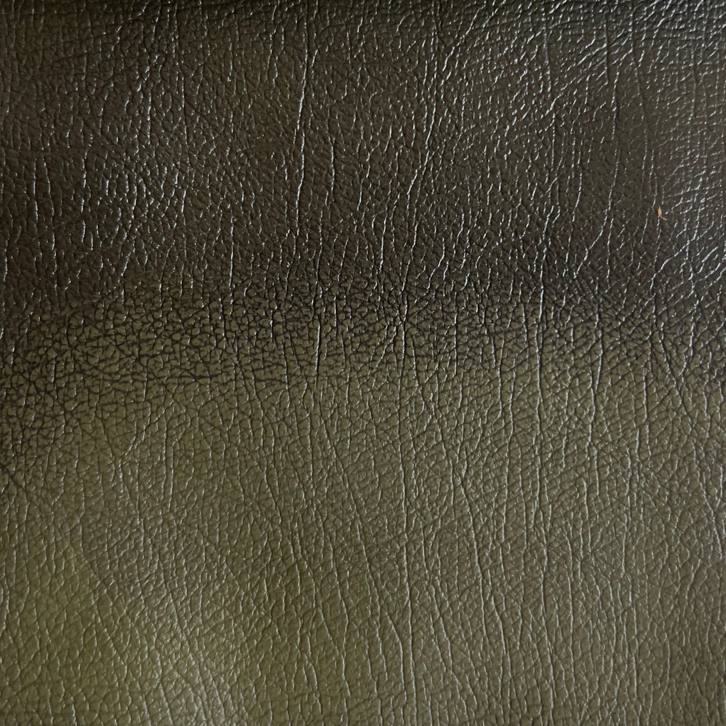Close-up of dark green leather texture