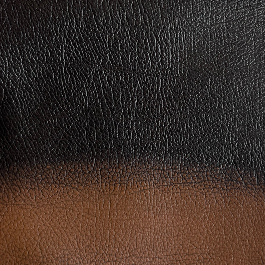 Gradient of black to brown leather texture