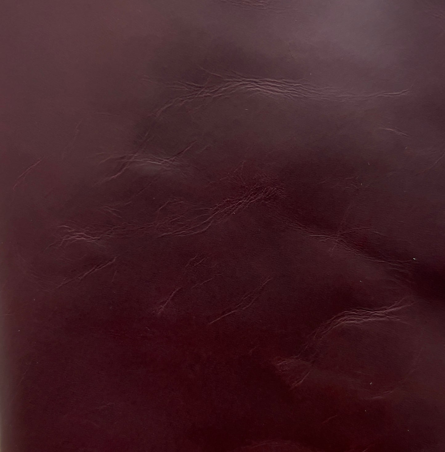 Close-up of maroon red leather texture