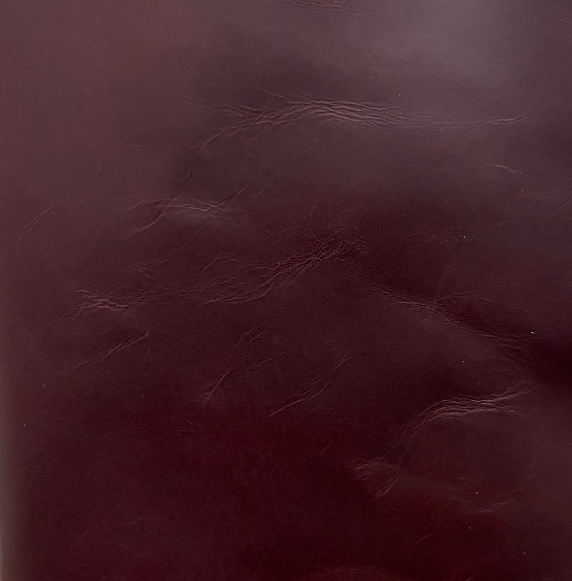 Close-up of maroon red leather texture