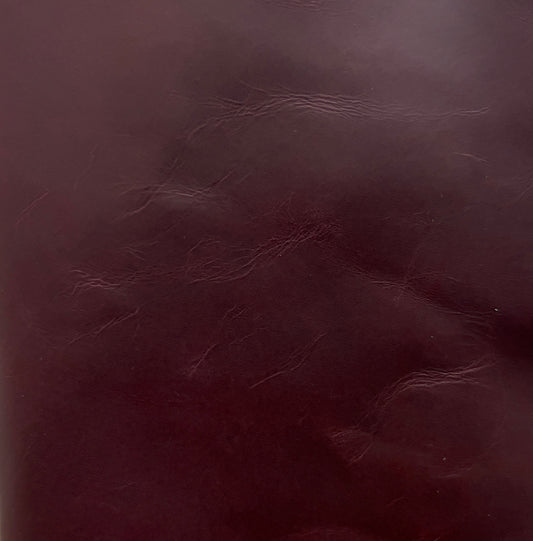 Close-up of maroon red leather texture