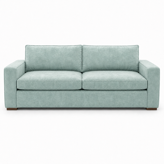 Light blue velvet sofa on a white background