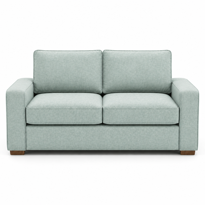 Light blue velvet sofa on a white background
