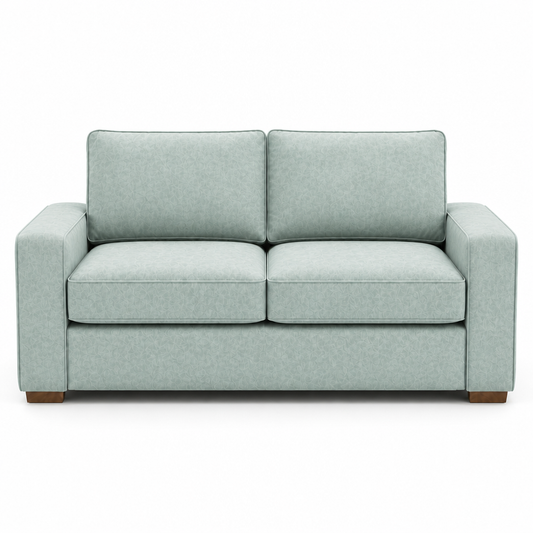 Light blue velvet sofa on a white background