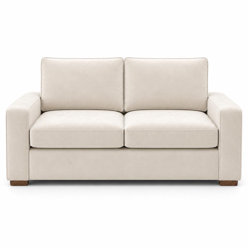 Cream velvet sofa on a white background