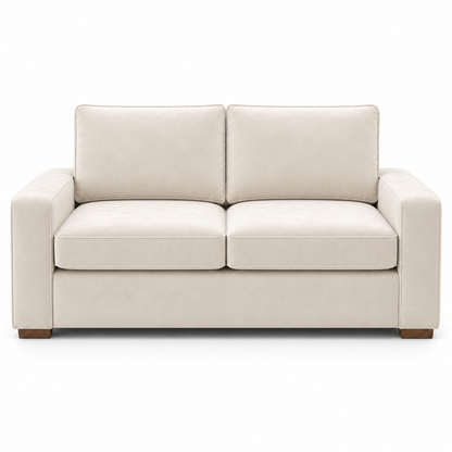 Cream velvet sofa on a white background