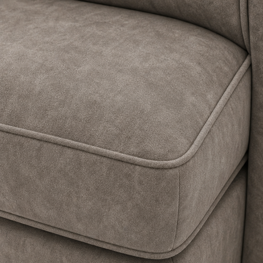 Close-up of a brown upholstered chair with visible stitching