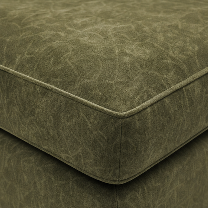 Close-up of a green textured sofa corner