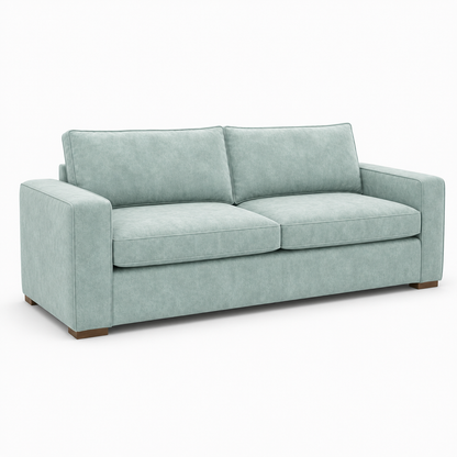Light blue velvet sofa on a white background