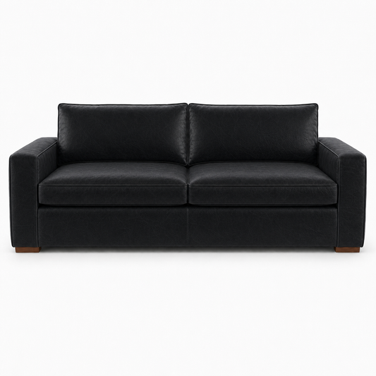 Black leather sofa on a white background