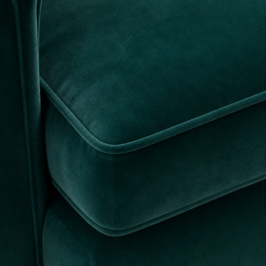 Close-up of dark teal velvet fabric with a soft texture