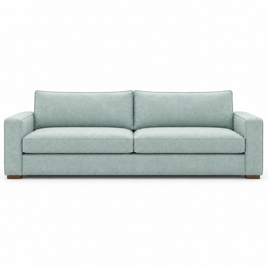 Light blue velvet sofa on a white background
