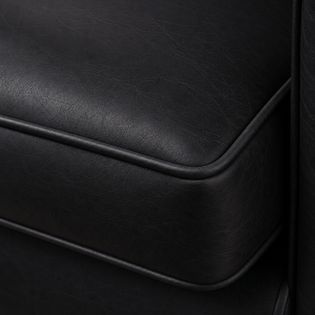 Close-up of a black leather surface with visible texture