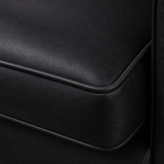 Close-up of a black leather surface with visible texture