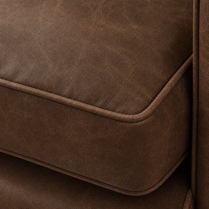 Close-up of a brown leather sofa corner