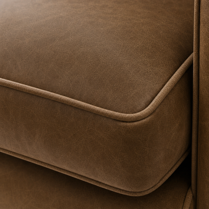 Close-up of a brown leather sofa corner