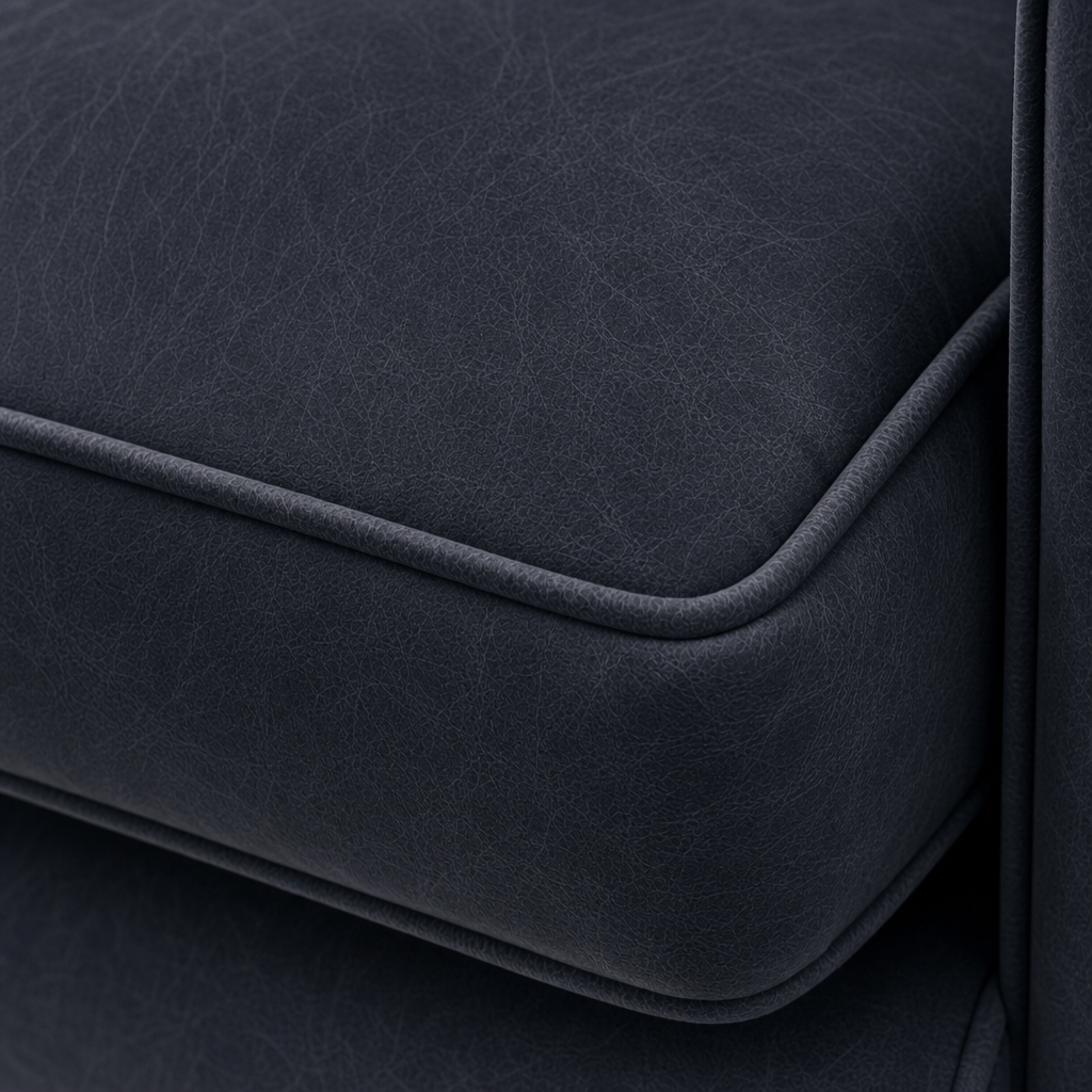 Close-up of a dark gray fabric surface with a subtle texture.