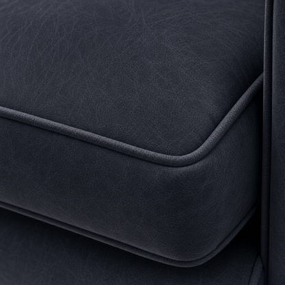 Close-up of a dark gray fabric surface with a subtle texture.
