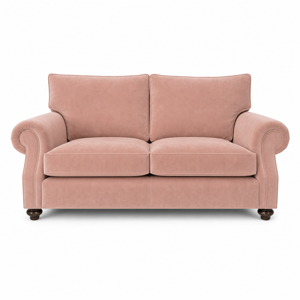 A classic two-seater loveseat sofa upholstered in dusty rose pink velvet, featuring rolled arms, dark wooden feet, and a clean silhouette, shown against a plain white background.