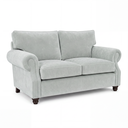 A light gray upholstered loveseat with rolled arms, two back cushions, two seat cushions, and dark wooden legs, shown on a plain white background.