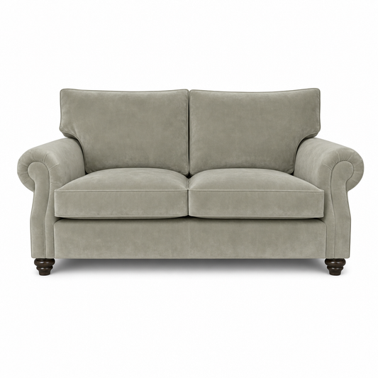 A classic two-seater loveseat sofa upholstered in a textured light gray fabric, featuring rolled arms, two back cushions, two seat cushions, and dark turned wooden legs, shown against a plain white background.
