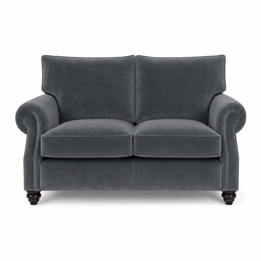 A dark gray velvet loveseat with rolled arms and dark wooden turned legs, shown from a front-facing perspective on a white background.