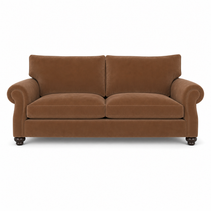 A classic two-seater loveseat sofa upholstered in a warm brown velvet fabric, featuring rolled arms, two back cushions, two seat cushions, and dark turned wood legs, shown against a plain white background.