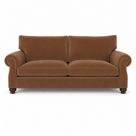 A classic two-seater loveseat sofa upholstered in a warm brown velvet fabric, featuring rolled arms, two back cushions, two seat cushions, and dark turned wood legs, shown against a plain white background.