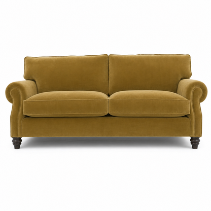 A classic two-seater loveseat sofa upholstered in a textured mustard yellow velvet fabric, featuring rolled arms, dark turned wood legs, and a clean white background.