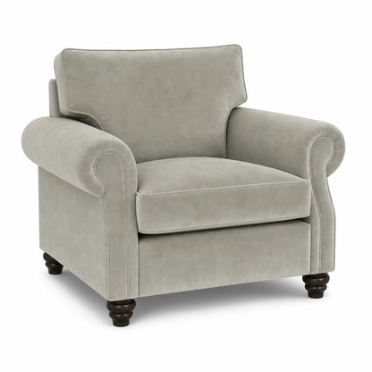 A classic upholstered armchair in a light gray fabric with dark brown turned wooden legs, shown against a plain white background.
