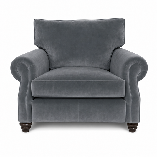A classic gray velvet armchair with rolled arms, a high backrest, and dark wooden turned legs, shown against a plain white background.