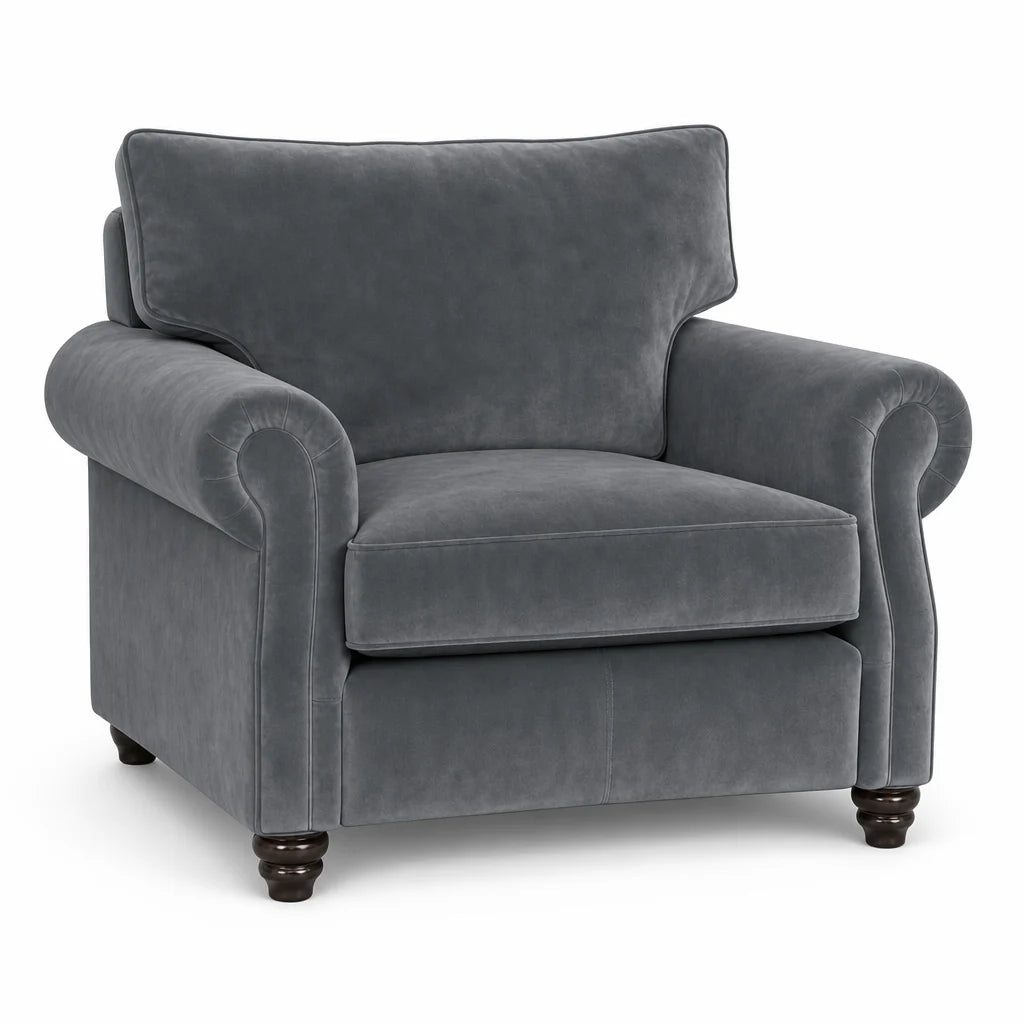 A classic gray velvet armchair with rolled arms, a high back cushion, and dark wooden turned legs, shown against a plain white background.