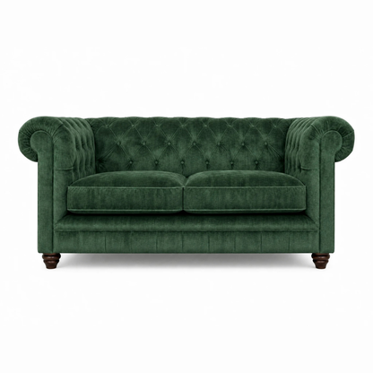 Green velvet sofa on a white background