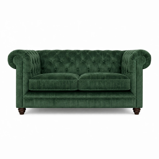 Green velvet sofa on a white background