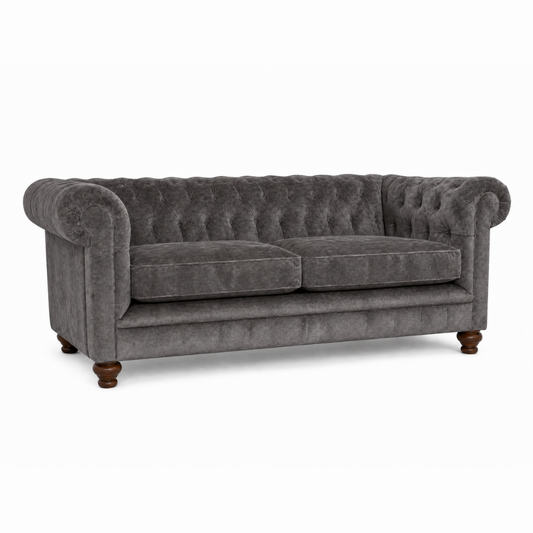 Gray velvet sofa with wooden legs on a white background
