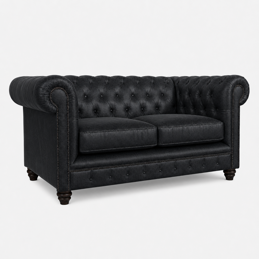 Black leather sofa with tufted backrest on a white background