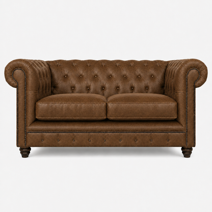 Brown leather sofa with tufted backrest on a white background