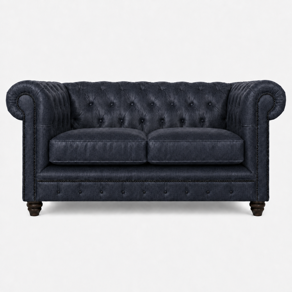 Blue velvet sofa with tufted backrest on a white background
